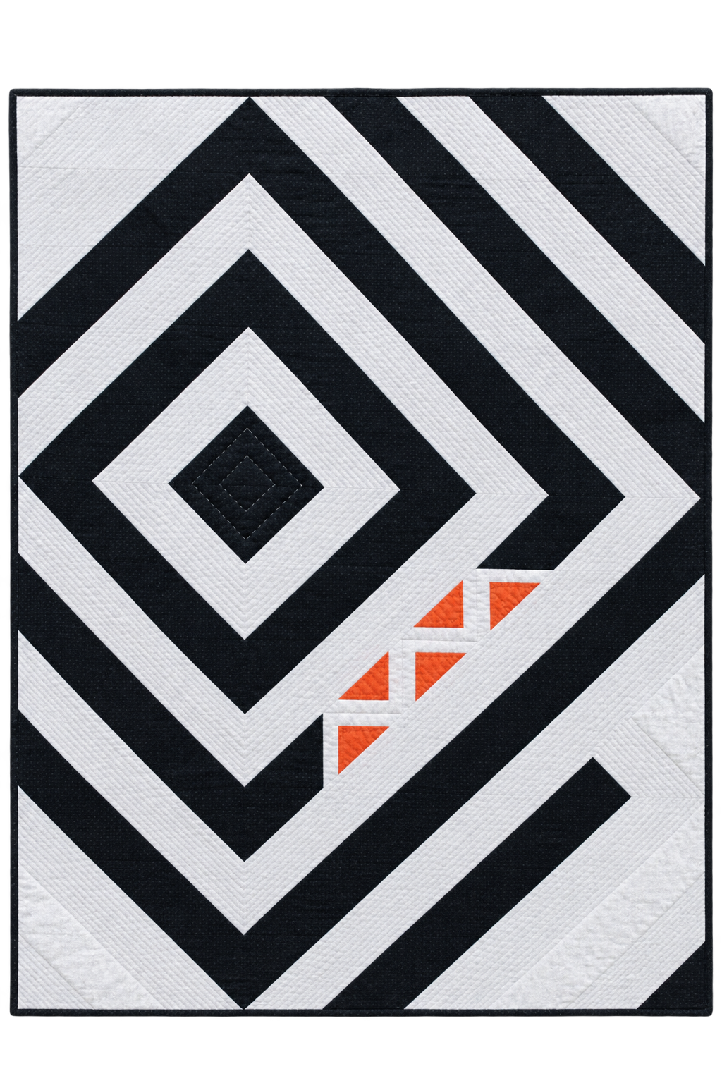 A square quilted rug or textile featuring a bold geometric pattern of black and white concentric diamonds and diagonal stripes, with a small cluster of orange triangles near the lower right area.