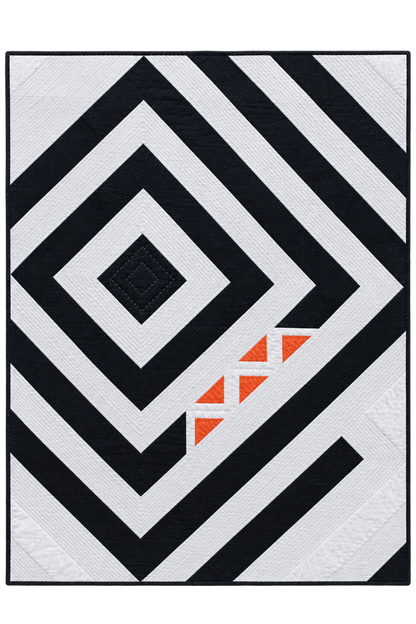 A square quilted rug or textile featuring a bold geometric pattern of black and white concentric diamonds and diagonal stripes, with a small cluster of orange triangles near the lower right area.